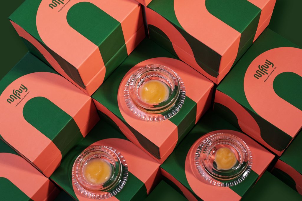Glass jars of cannabis concentrate on MFNY boxes at a Schenectady dispensary